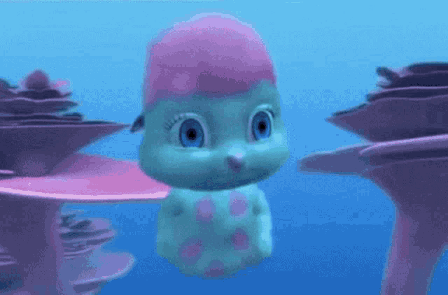 a cartoon character with blue eyes and a pink hat is swimming in the ocean .