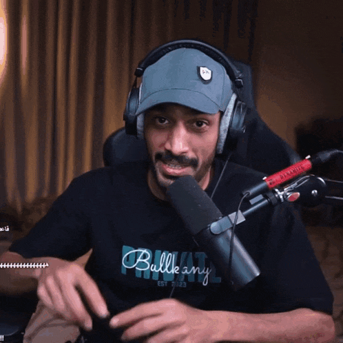 a man wearing headphones and a shirt that says ballkany