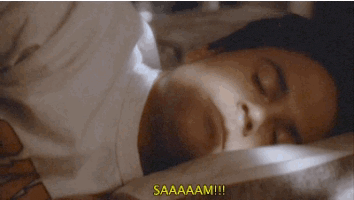 a person laying in bed with the words saaaaam on the bottom right