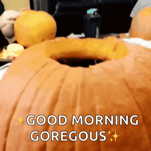 a pumpkin with a hole in it and the words " good morning gorgeous " on it
