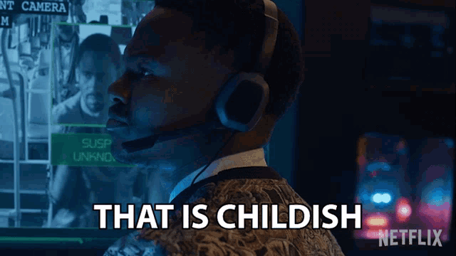 a man wearing headphones says " that is childish "