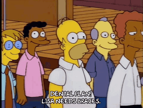 a group of cartoon characters are standing in a line with homer simpson saying " dental plan lisa needs braces "