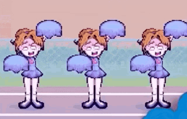 a group of cheerleaders are dancing in a row on a field .
