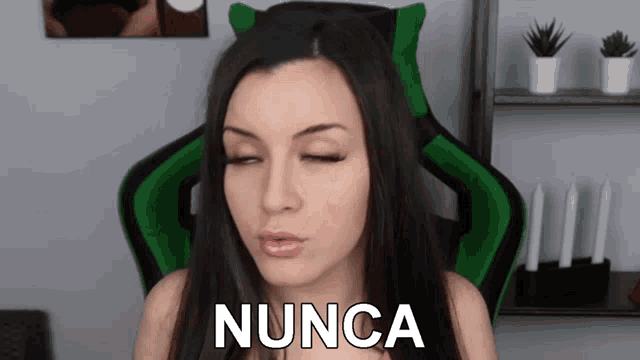 a woman in a green chair says nunca
