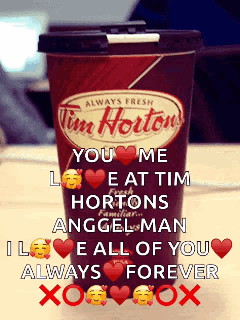 a cup of tim hortons coffee with a love message on it