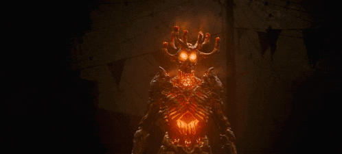 a demon with glowing eyes and horns is surrounded by candles in a dark room