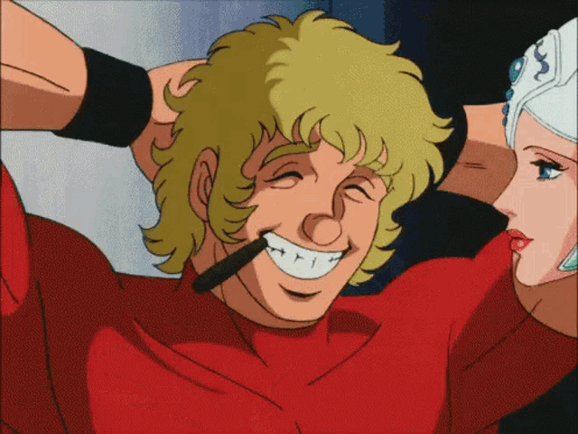 a man in a red shirt is smiling with a woman in a white dress behind him