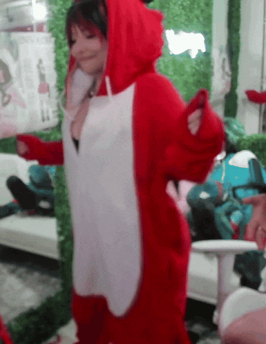 a woman in a red and white fox costume