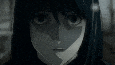 a close up of a person 's face with a serious look on their face