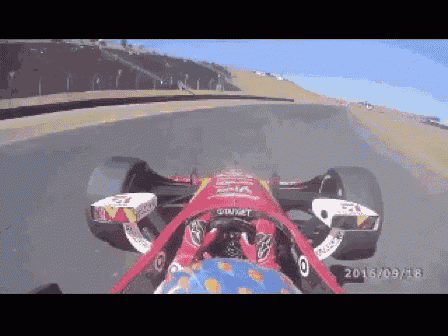 a red race car is driving down a track with the date 2016/09/19