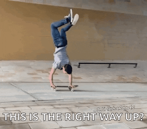 a man is doing a handstand on a skateboard and the caption says this is the right way up