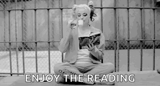 a woman is sitting on the ground reading a book while drinking milk .
