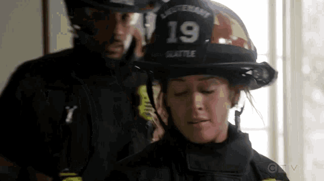 a woman wearing a helmet that says 19 on it