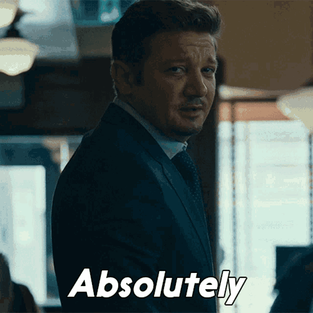 a man in a suit and tie has the word absolutely on his face