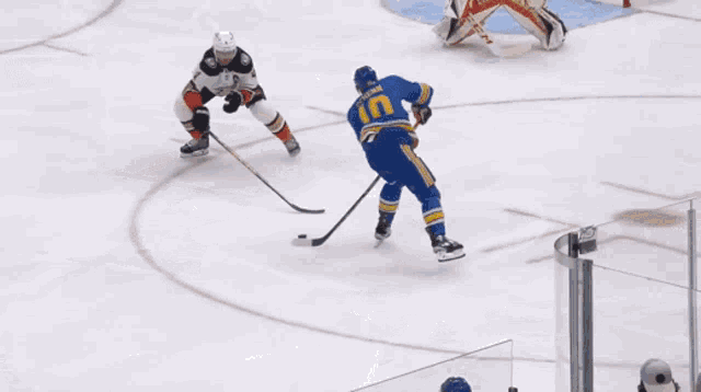 a hockey game is being played in front of an advertisement for pnc bank