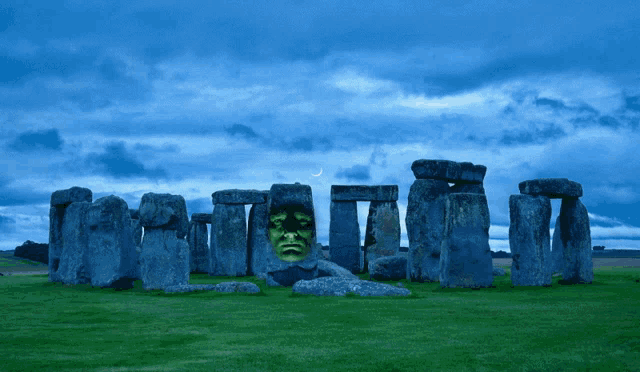 a statue of a man with a green face is in front of a stone wall