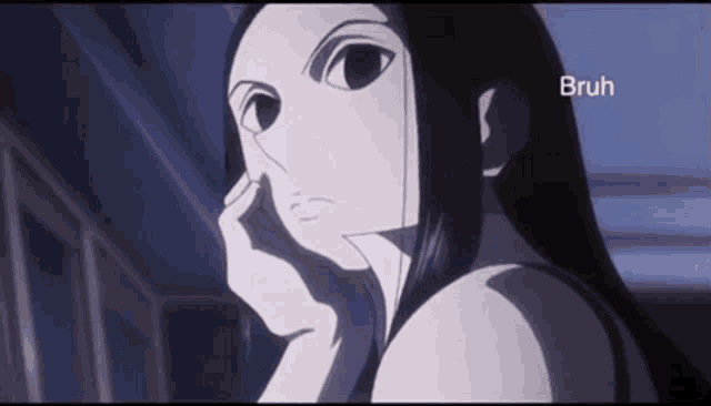 a girl with long black hair is looking at the camera with her hand on her face .