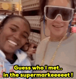 two women are posing for a picture and the caption says guess who i met in the supermarkeeet