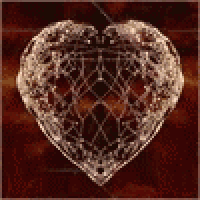 a close up of a heart shaped pendant on a wooden table .