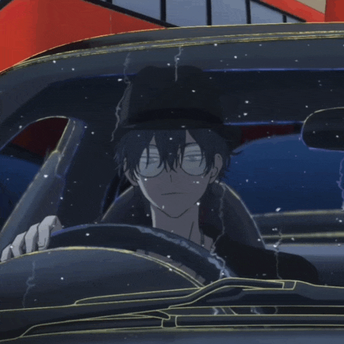 a man wearing a hat and glasses is driving a car