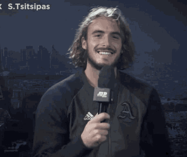 a man holding a microphone says yes