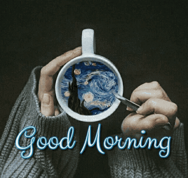 a person is holding a cup of coffee with a starry night painting inside