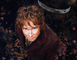 a man in a red coat is looking up at something