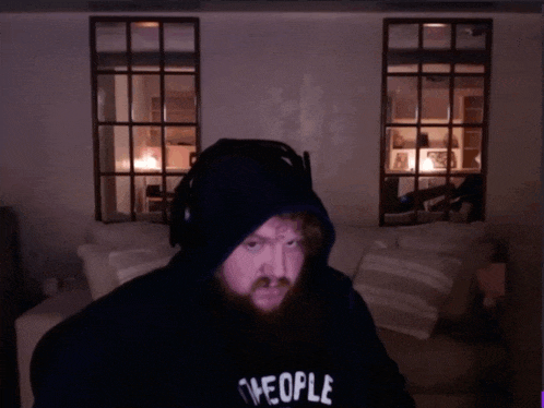 a man wearing a hoodie that says the people on it