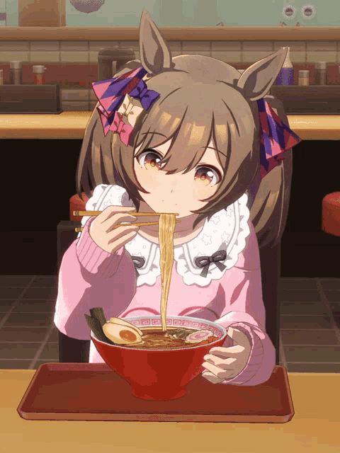 a girl in a pink sweater is eating a bowl of ramen with chopsticks