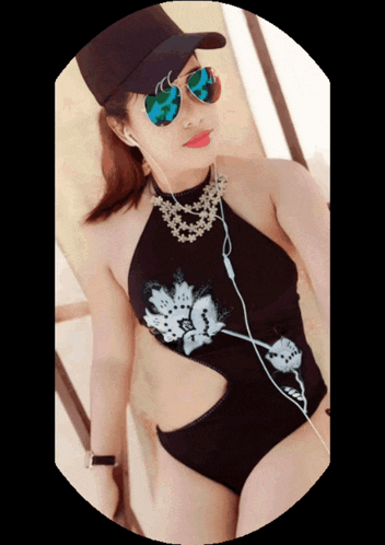 a woman in a black swimsuit and sunglasses is wearing a hat