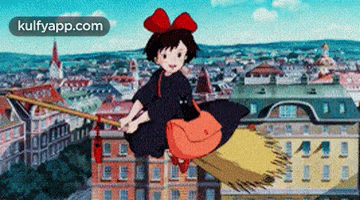 a girl with a red bow is flying on a broom in front of a city