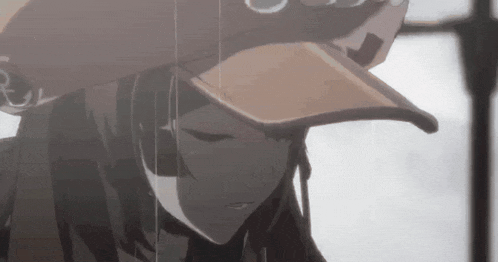 a close up of a girl wearing a baseball cap