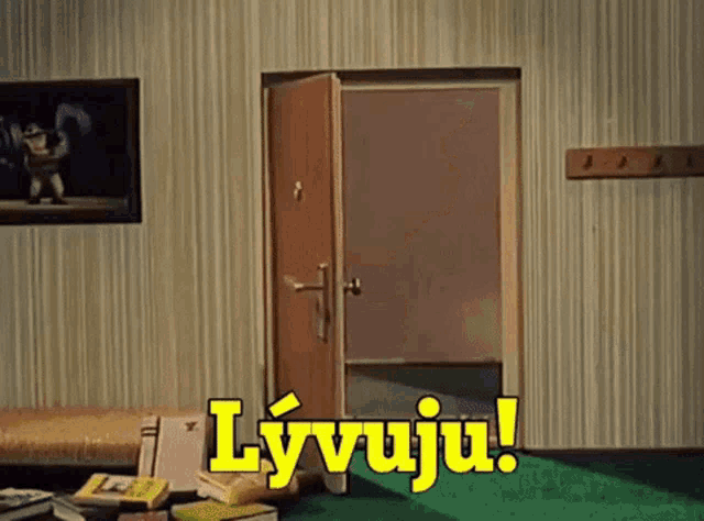 a room with a door and the words " lyvuju " on the wall
