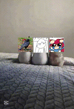 a picture of a bird a girl and a cartoon character is displayed on a bed