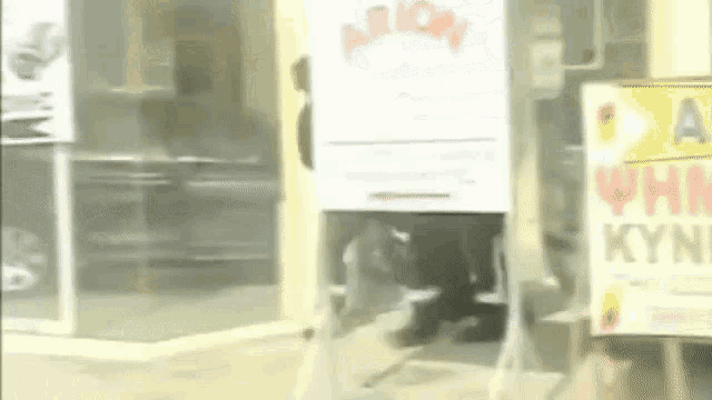 a blurred image of a store front with a sign that says arion