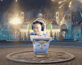a man wearing headphones is sitting in a bucket