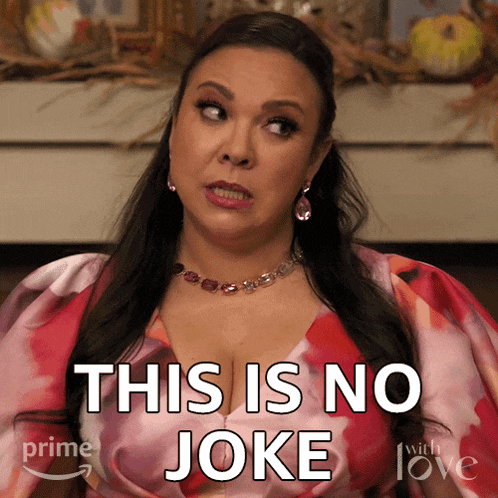 a woman says this is no joke while wearing a pink and red dress