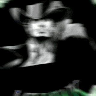 a blurry picture of a man wearing a top hat and sunglasses .