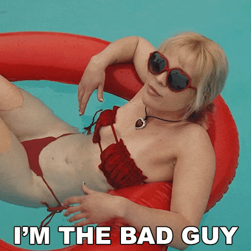a woman in a bikini is floating in a pool with the words " i 'm the bad guy " above her