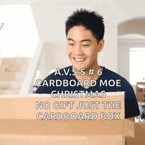 a man is smiling while looking at a cardboard box that says a.v.s.s # 6