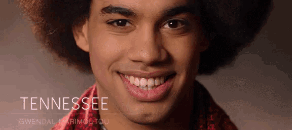 a man is smiling with the word tennessee on the bottom right