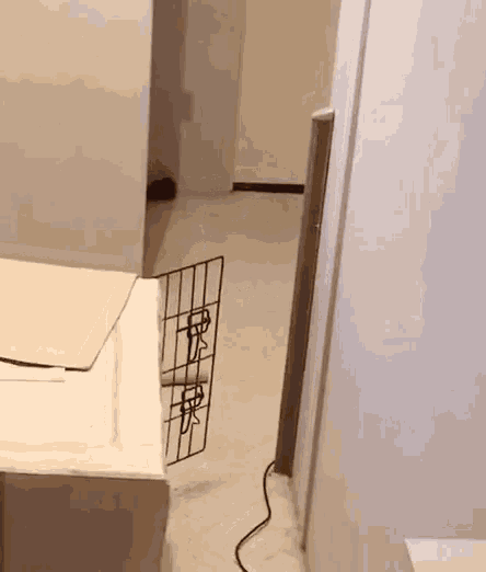 a white refrigerator with a wire fence on the side of it