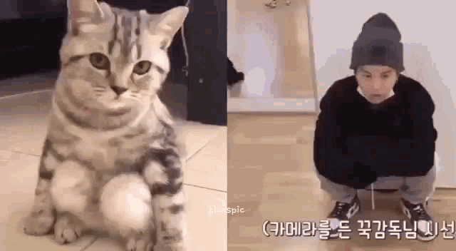 a cat is sitting next to a man wearing a hat and a mask .
