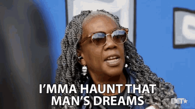 a woman wearing sunglasses and earrings says i 'mma haunt that man 's dreams