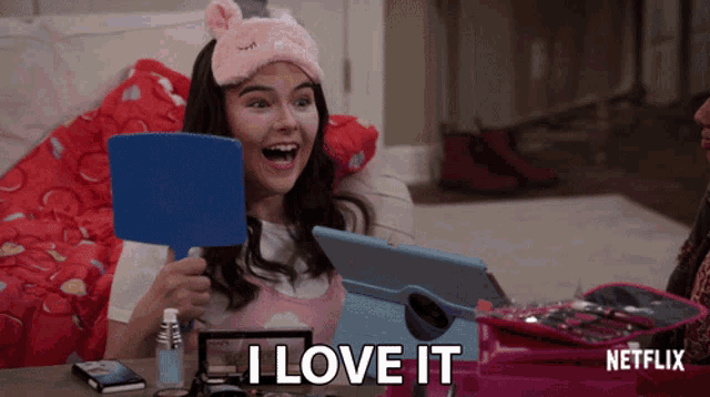 a woman is looking at herself in a mirror and says " i love it "