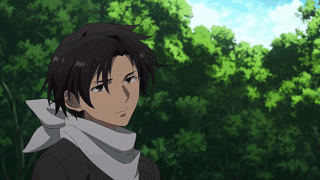 a young man with a scarf around his neck stands in front of some trees