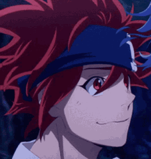 a close up of a person with red hair and a blue headband