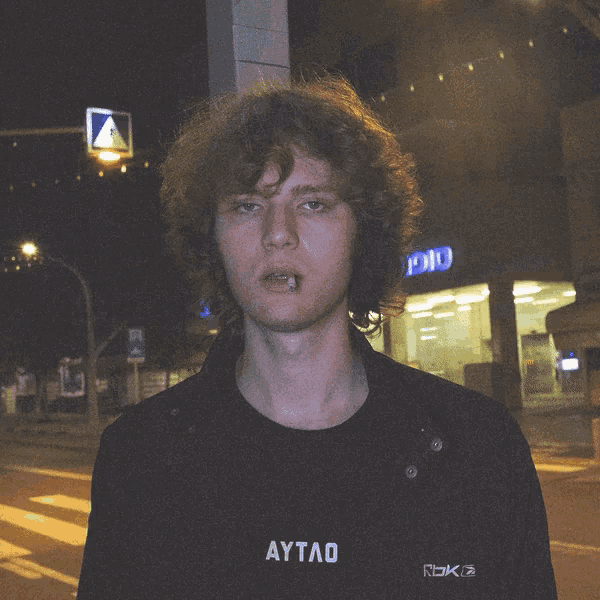 a man wearing a black shirt that says aytao