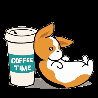 a corgi dog is sitting next to a cup of coffee .