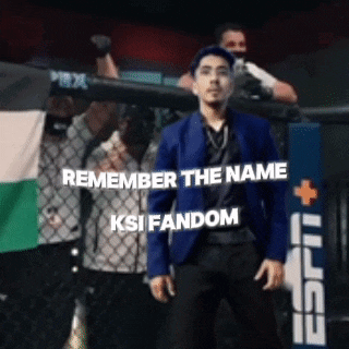 a man in a blue jacket stands in front of a cage with the words " remember the name ksi fandom " written on it